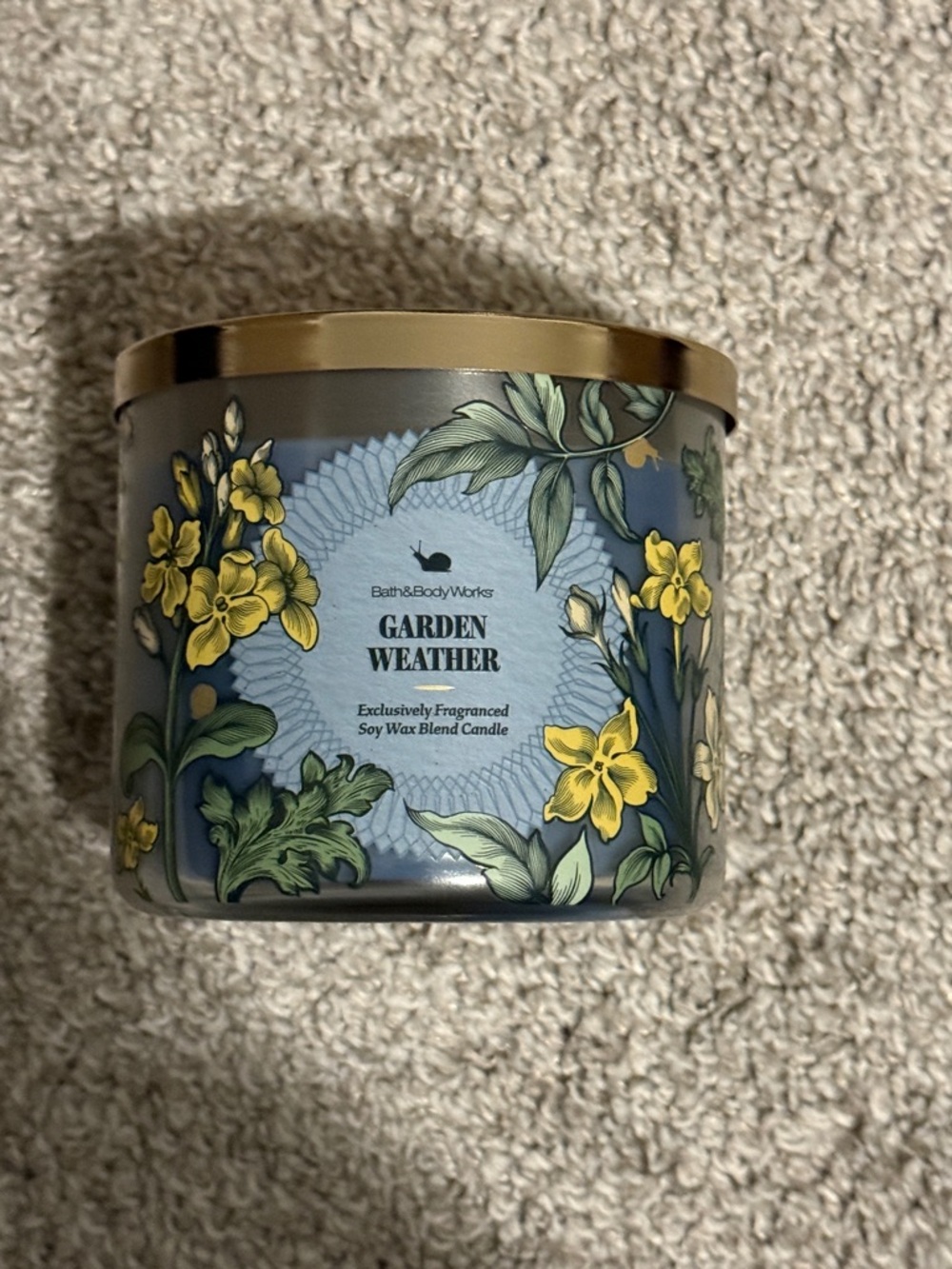 Bath & Body Works Blue Tin Candle with Yellow Floral Design